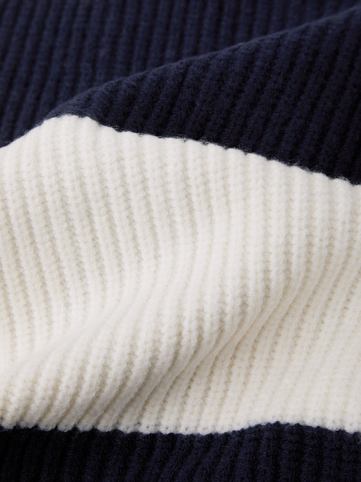 Close-up of a navy and white striped fabric texture