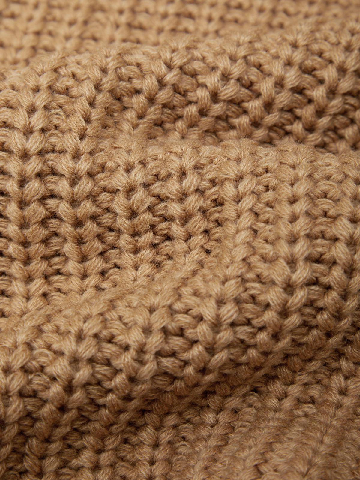 Close-up of a brown knitted fabric texture