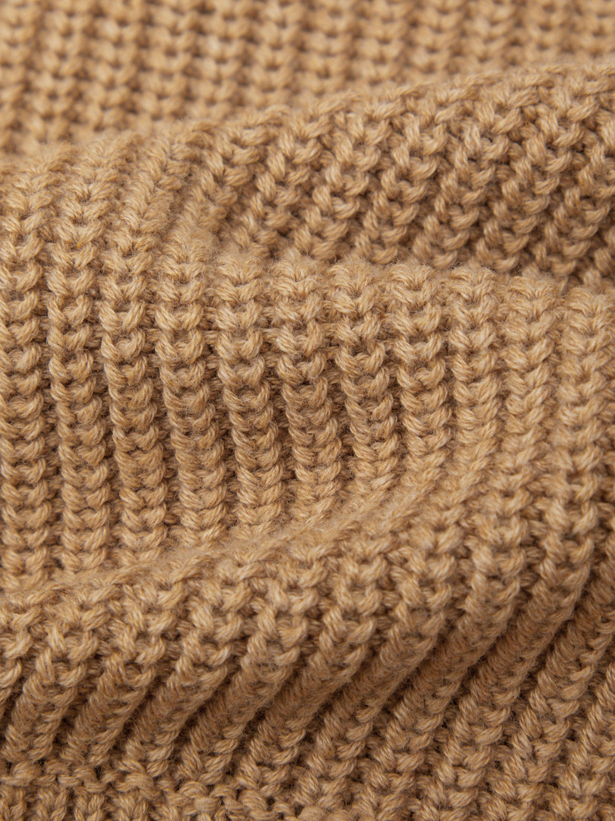 Close-up of a brown knitted fabric texture