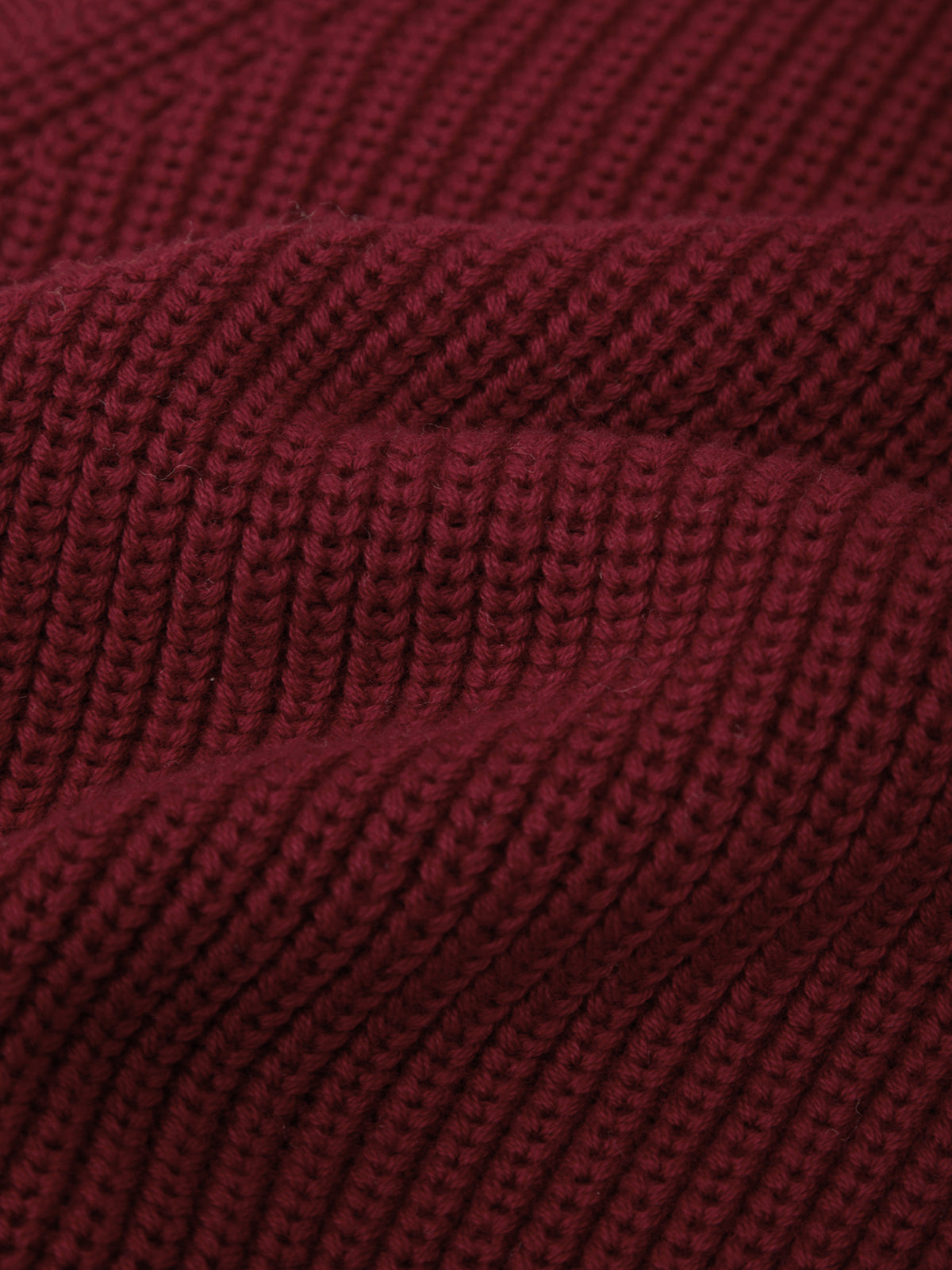 Close-up of a textured burgundy fabric surface