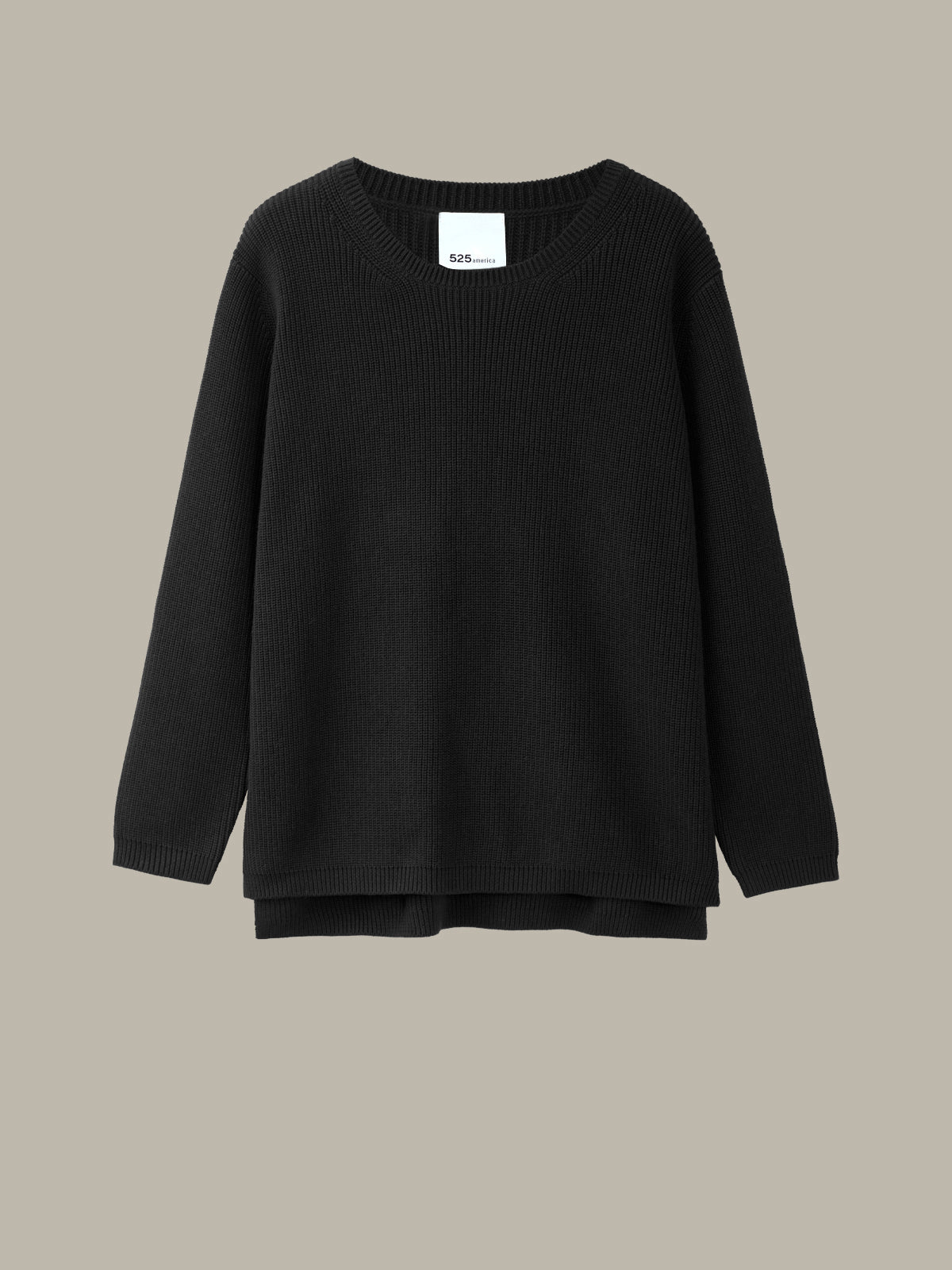 Black sweater on a beige background