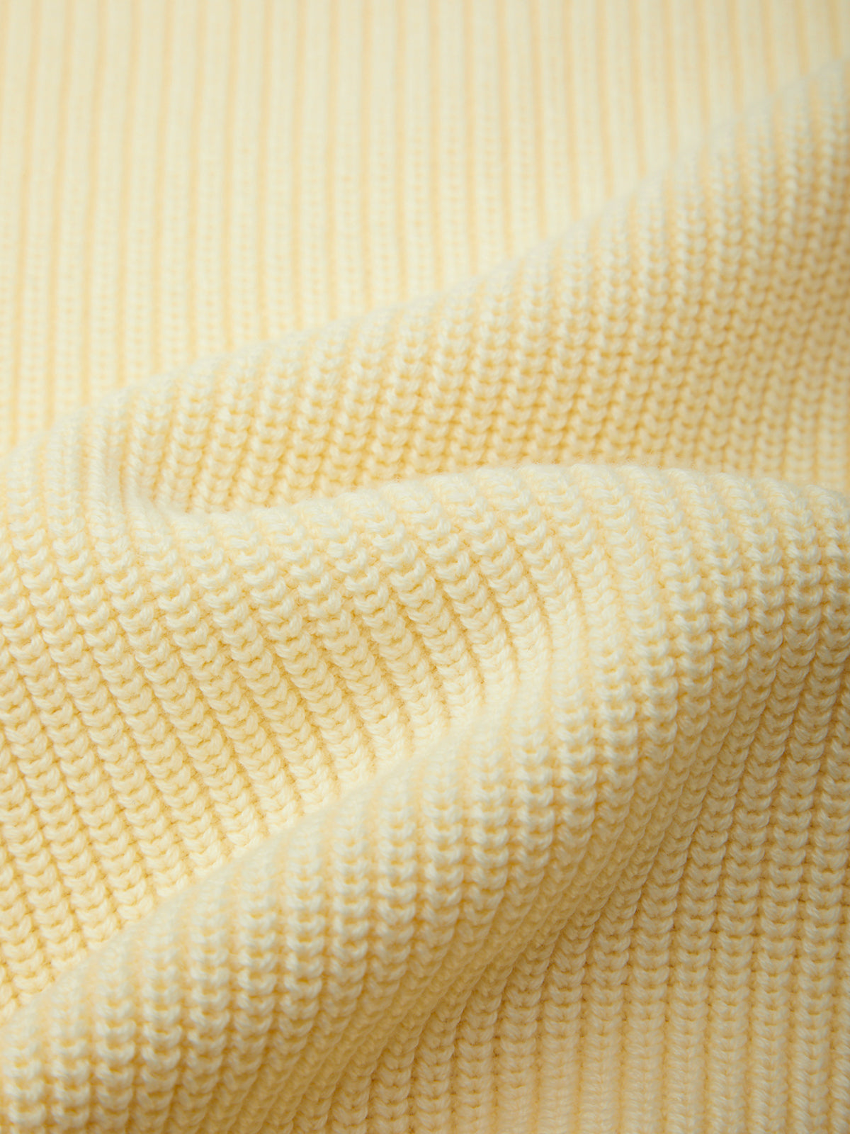 Close-up of textured yellow fabric