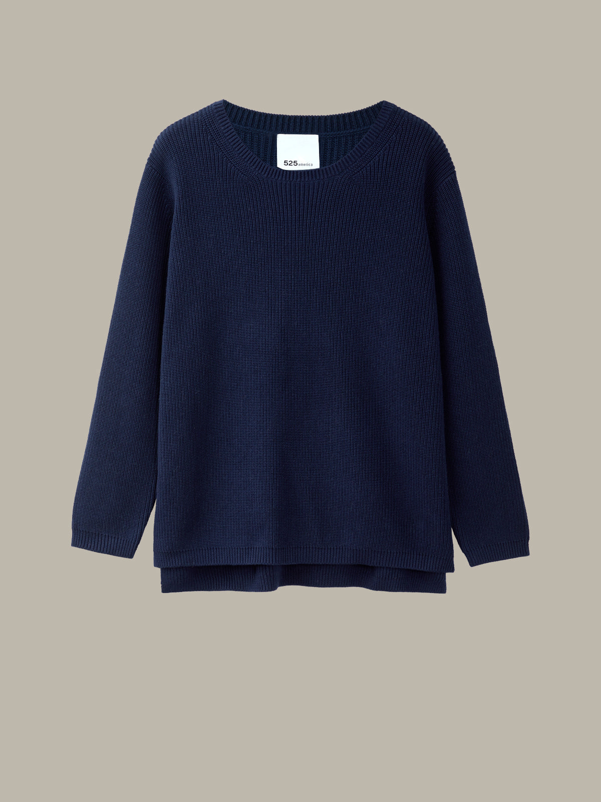Navy blue sweater on a beige background