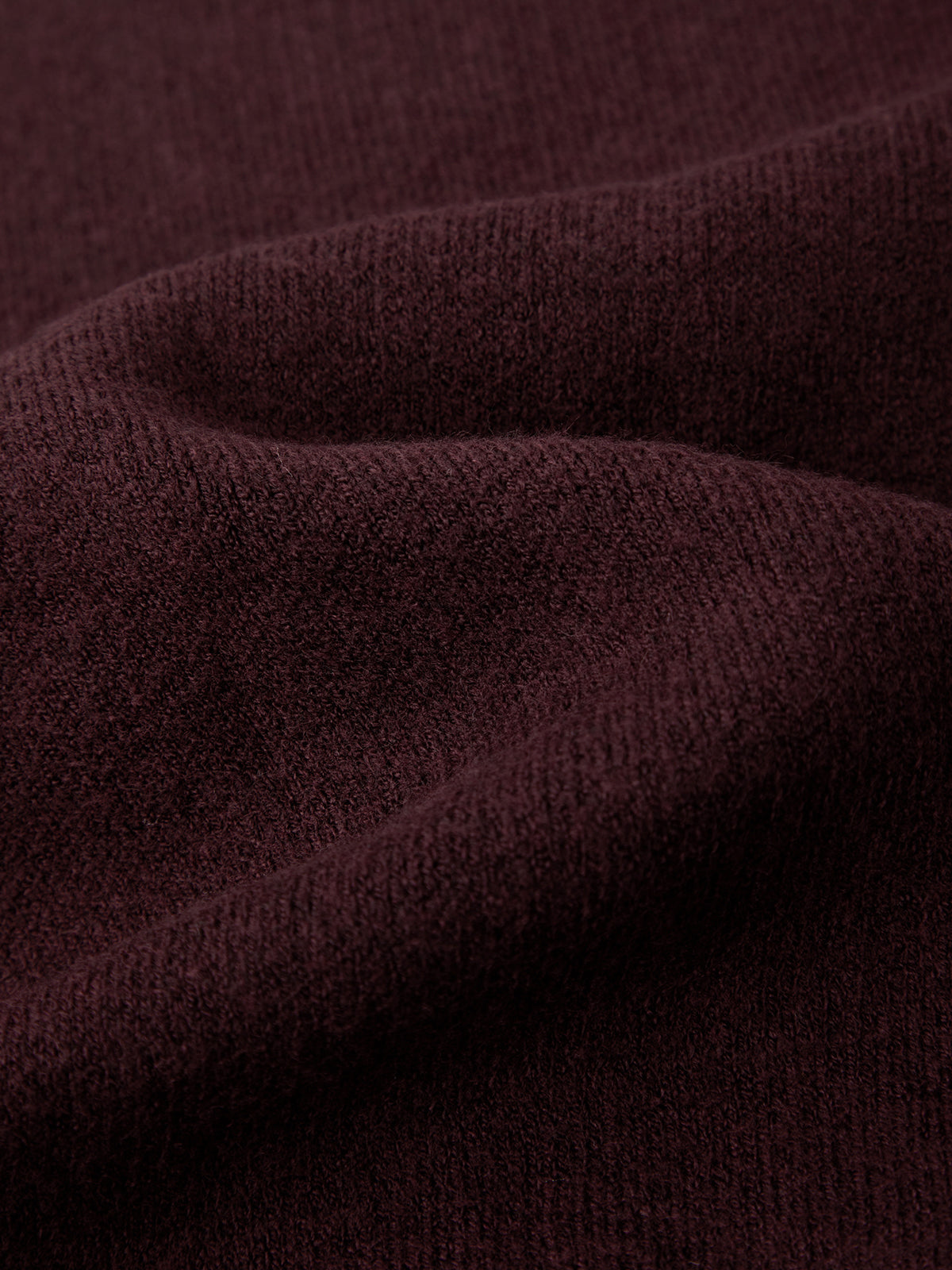 Close-up of dark brown fabric texture