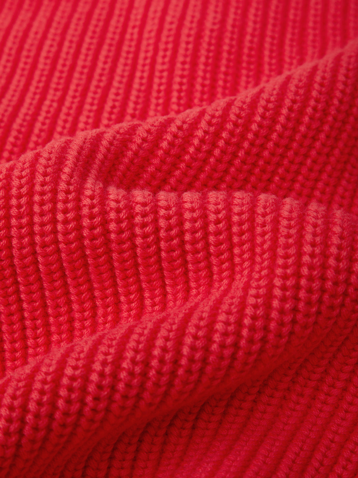 Close-up of red knitted fabric texture