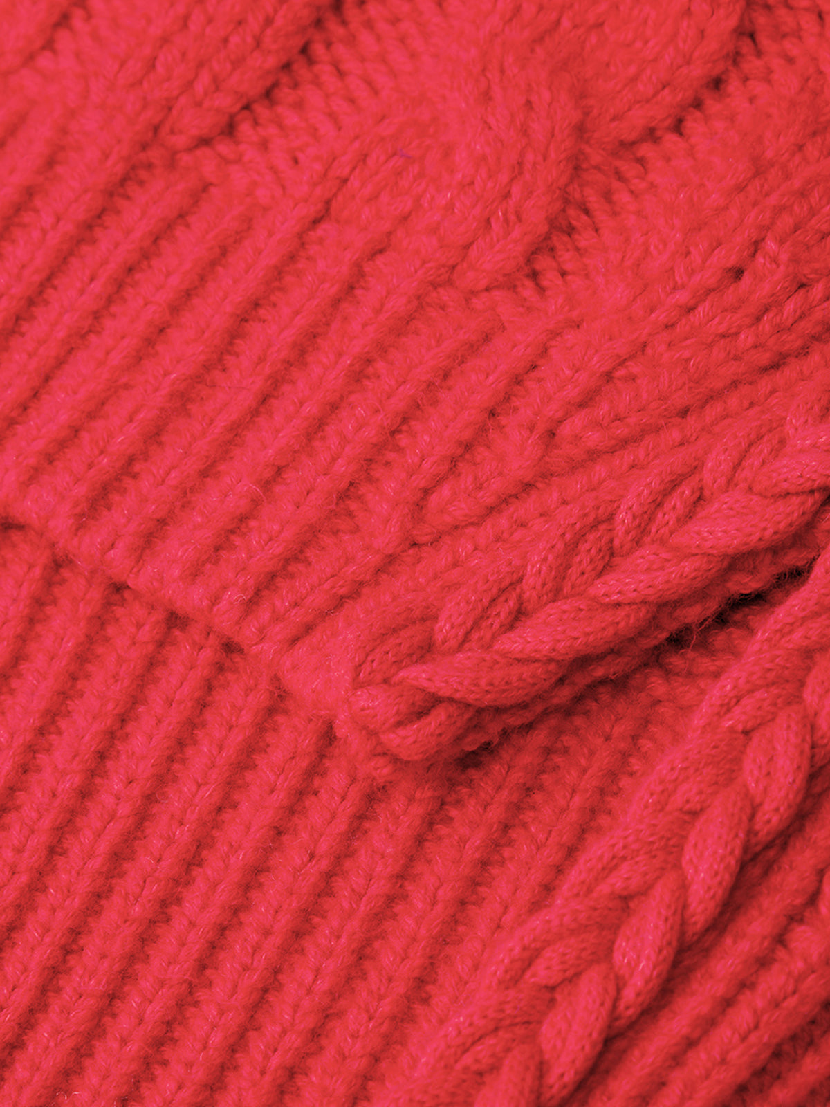 Close-up of red yarn with a textured pattern
