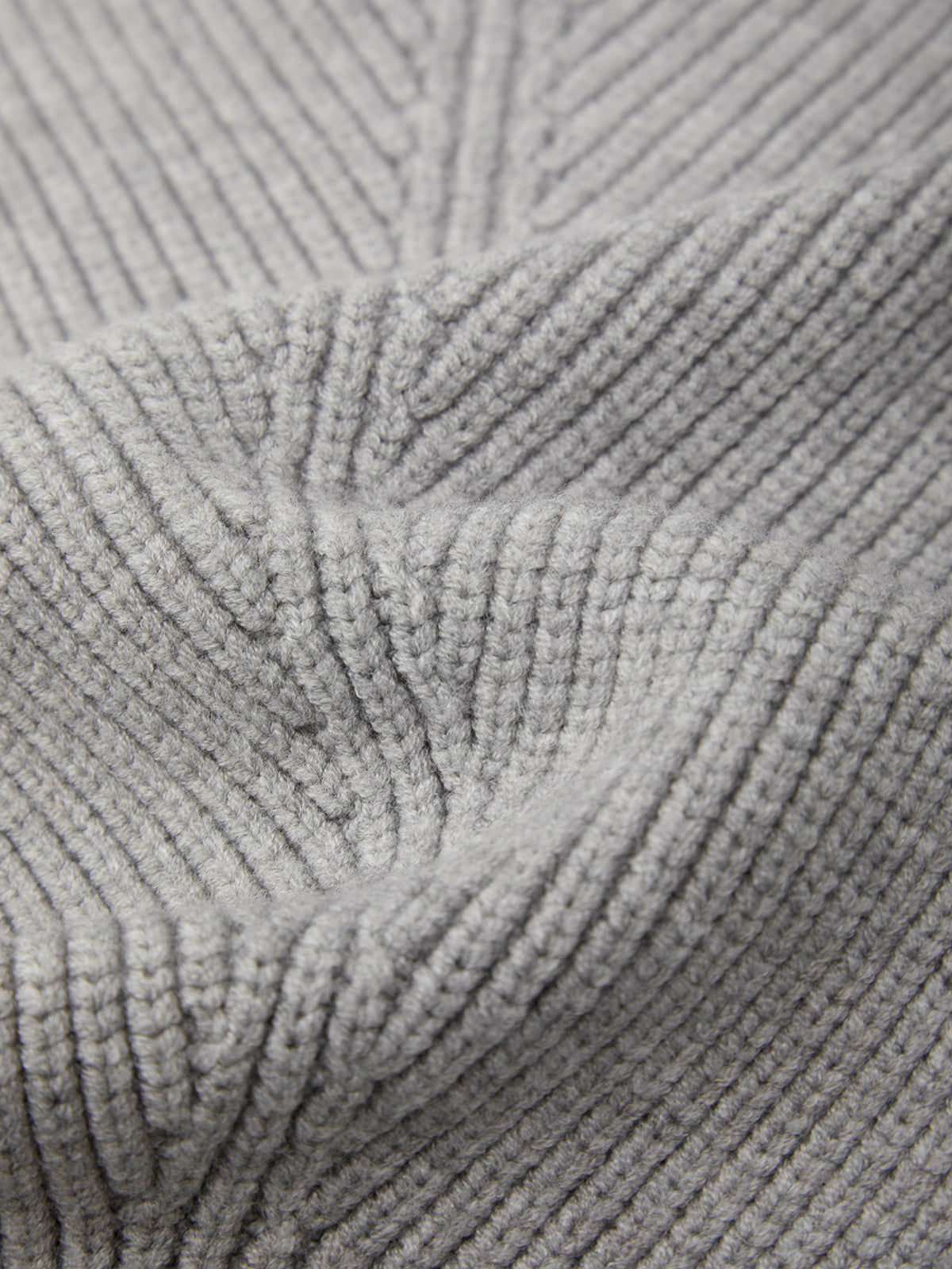 Close-up of textured gray fabric with a ribbed pattern