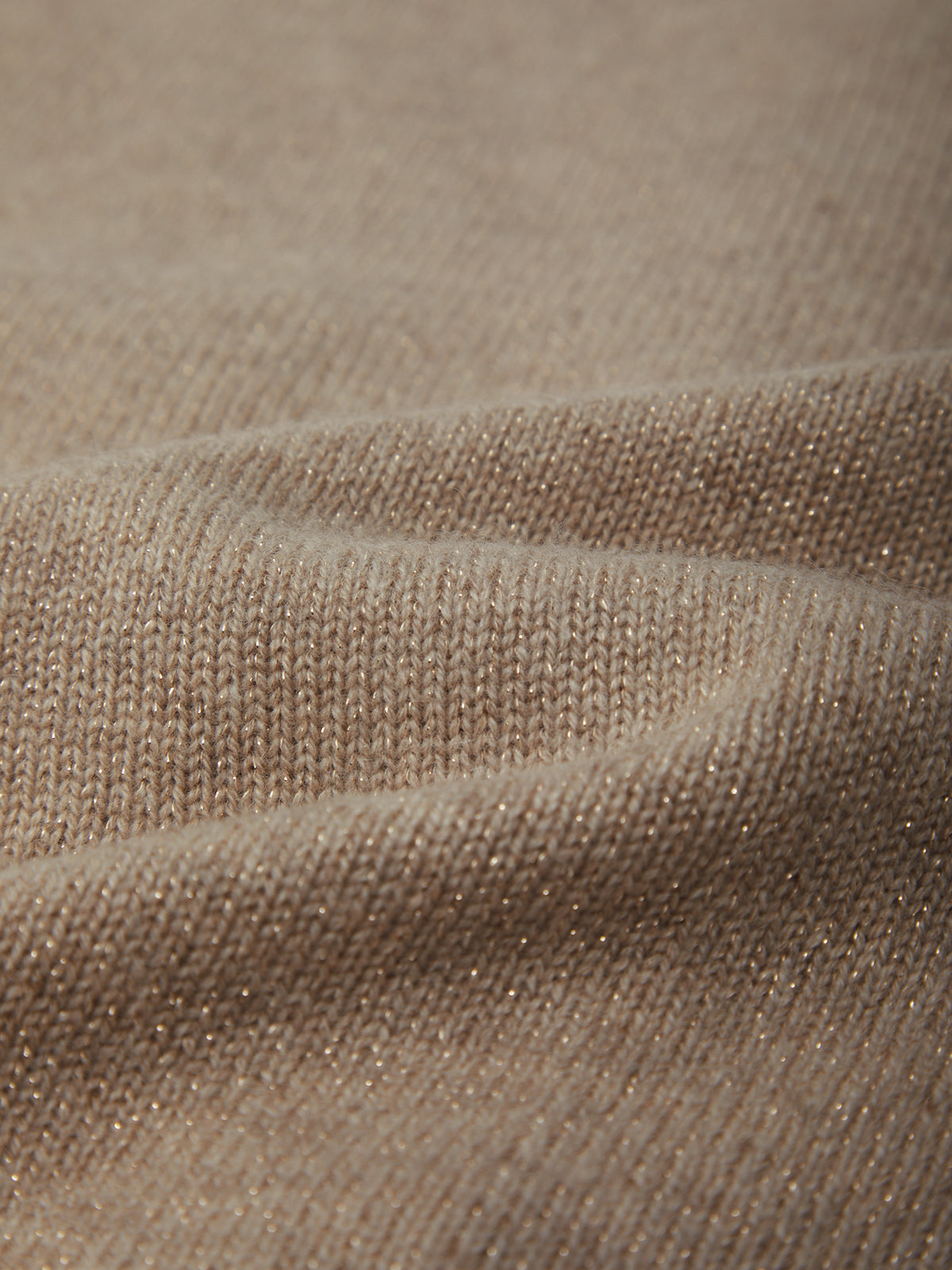 Close-up of beige fabric with a textured pattern
