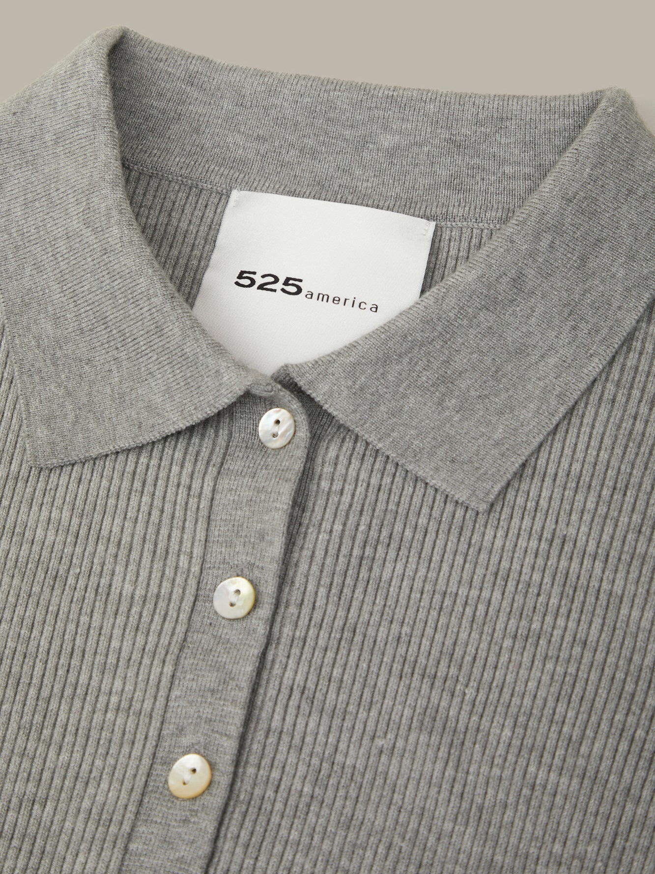 Gray ribbed sweater with a collar and buttons, featuring the brand '525 America'.