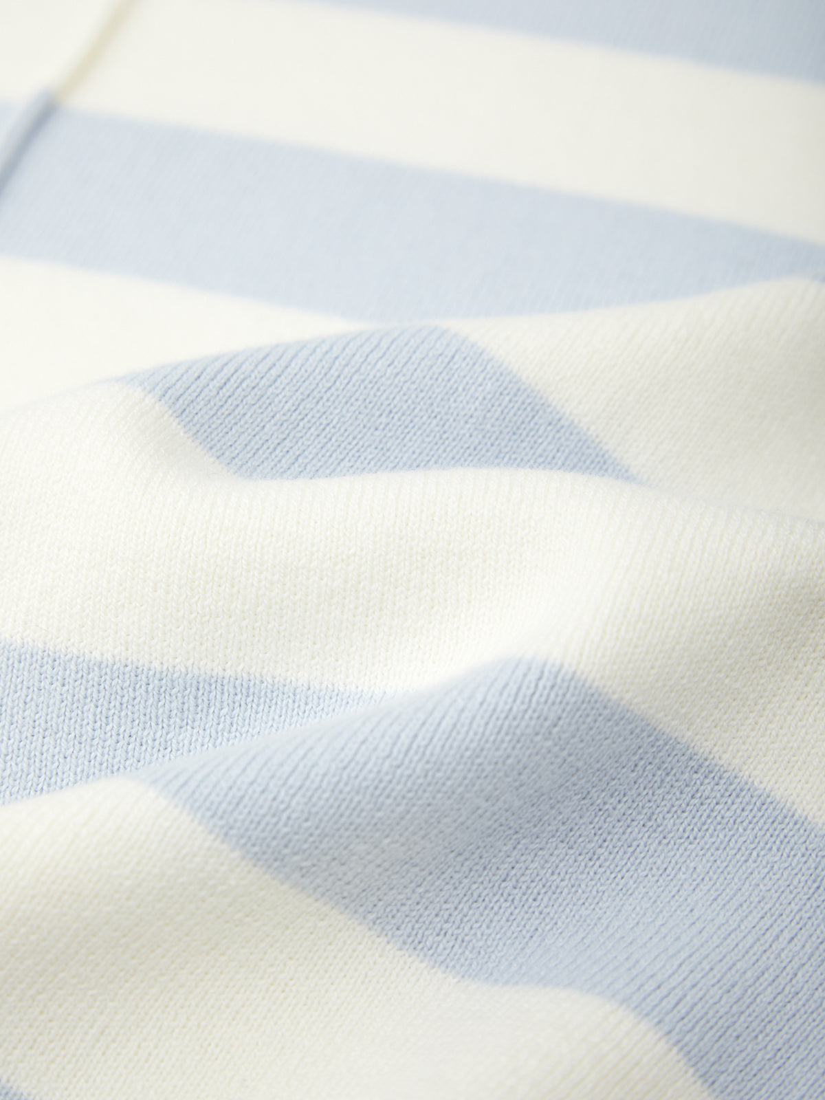 Close-up of a fabric with blue and white striped pattern
