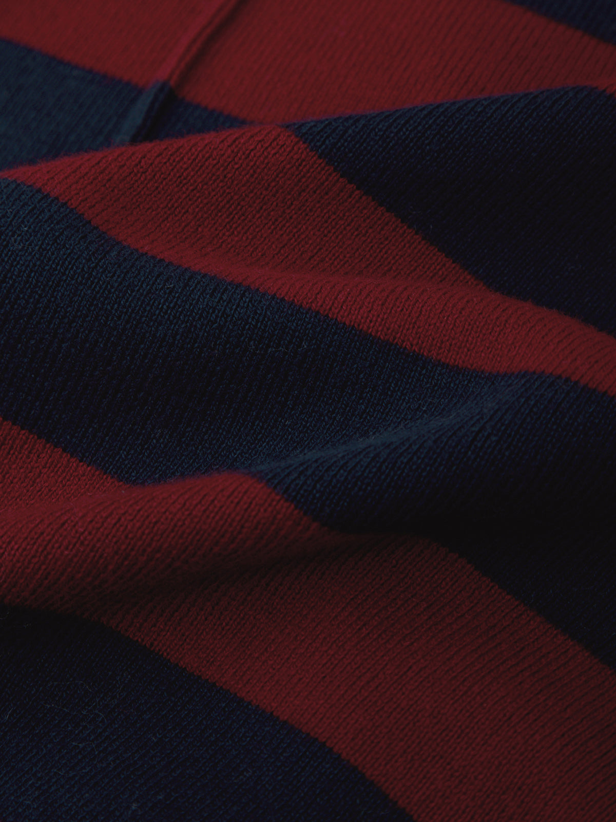 Close-up of red and navy striped fabric texture