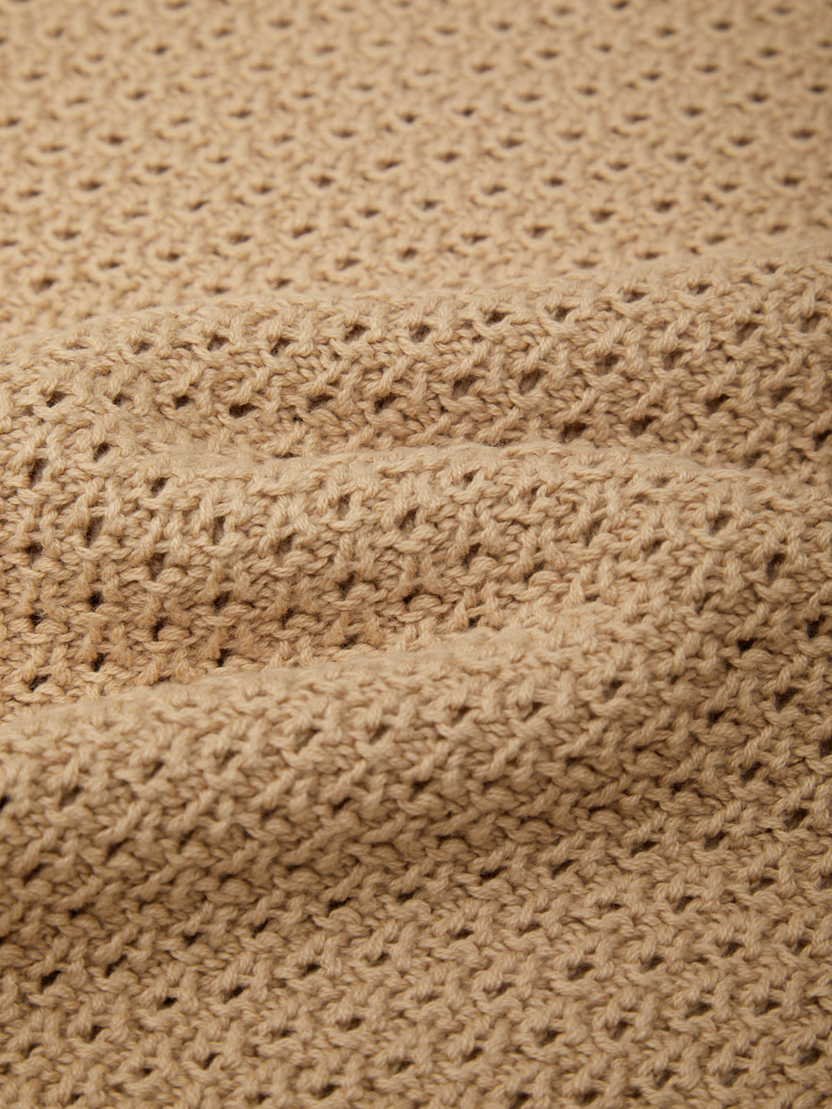 Close-up of beige textured fabric