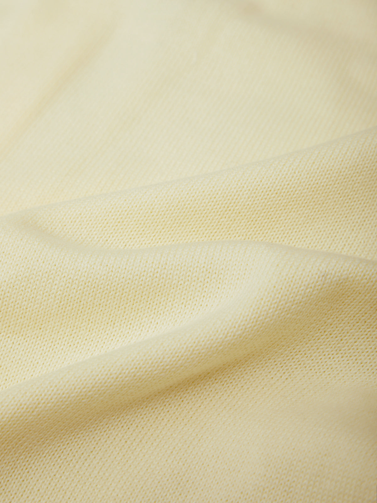Close-up of beige fabric with subtle texture
