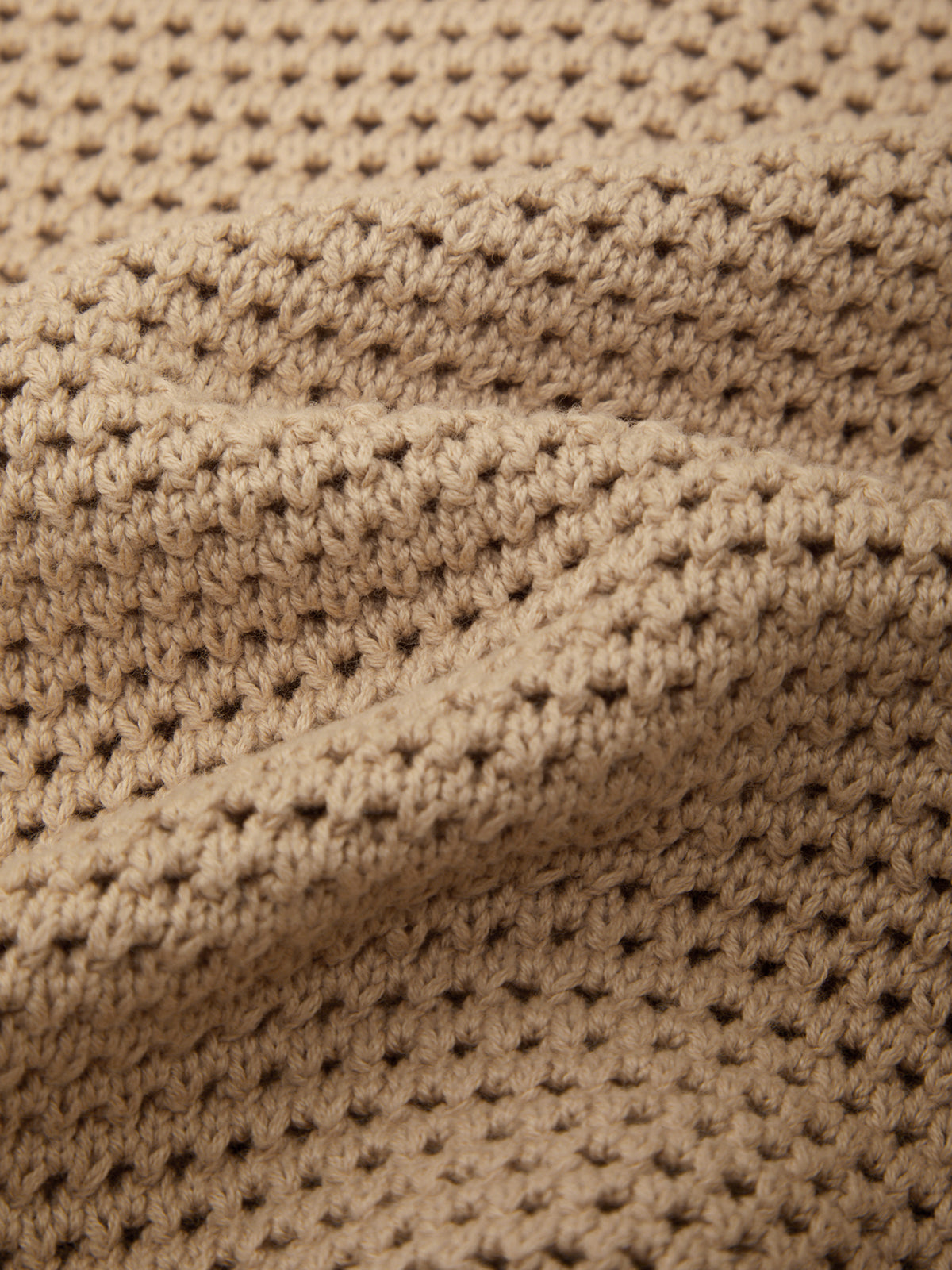 Close-up of beige textured fabric
