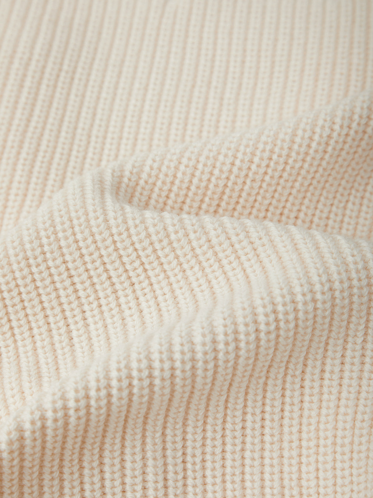 Close-up of beige textured fabric