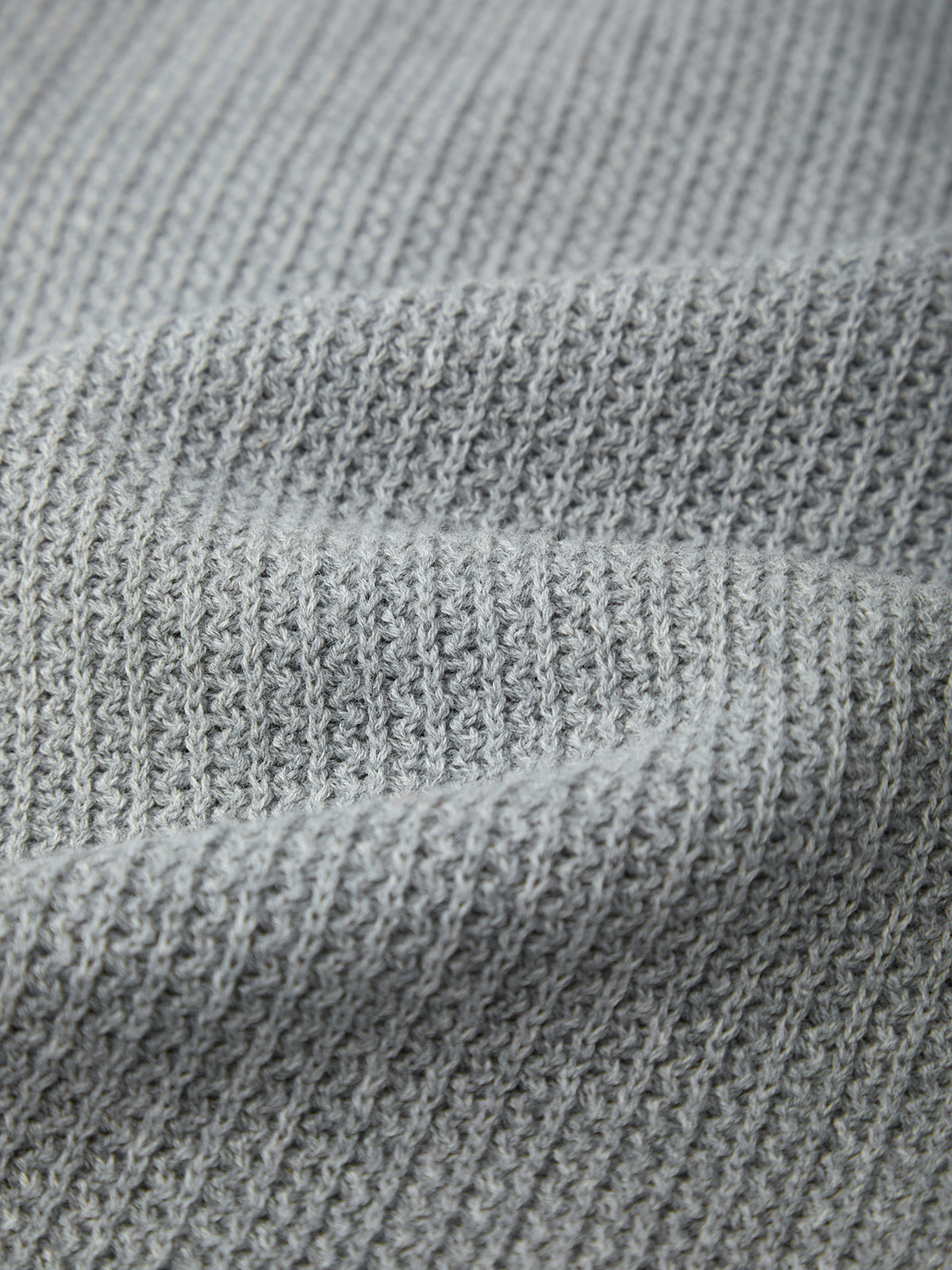 Close-up of gray fabric with a textured pattern