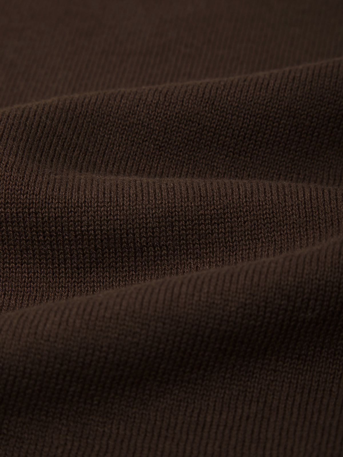 Close-up of brown ribbed fabric texture