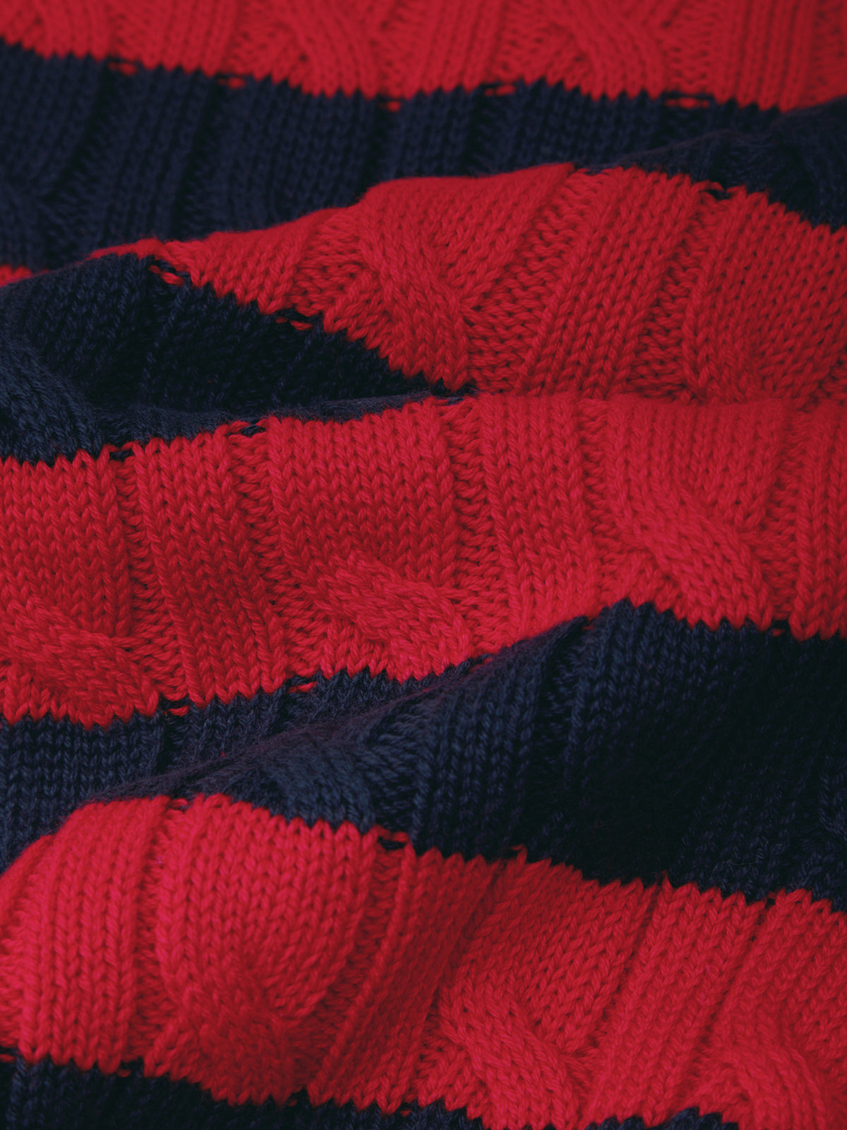 Close-up of a red and navy striped fabric texture