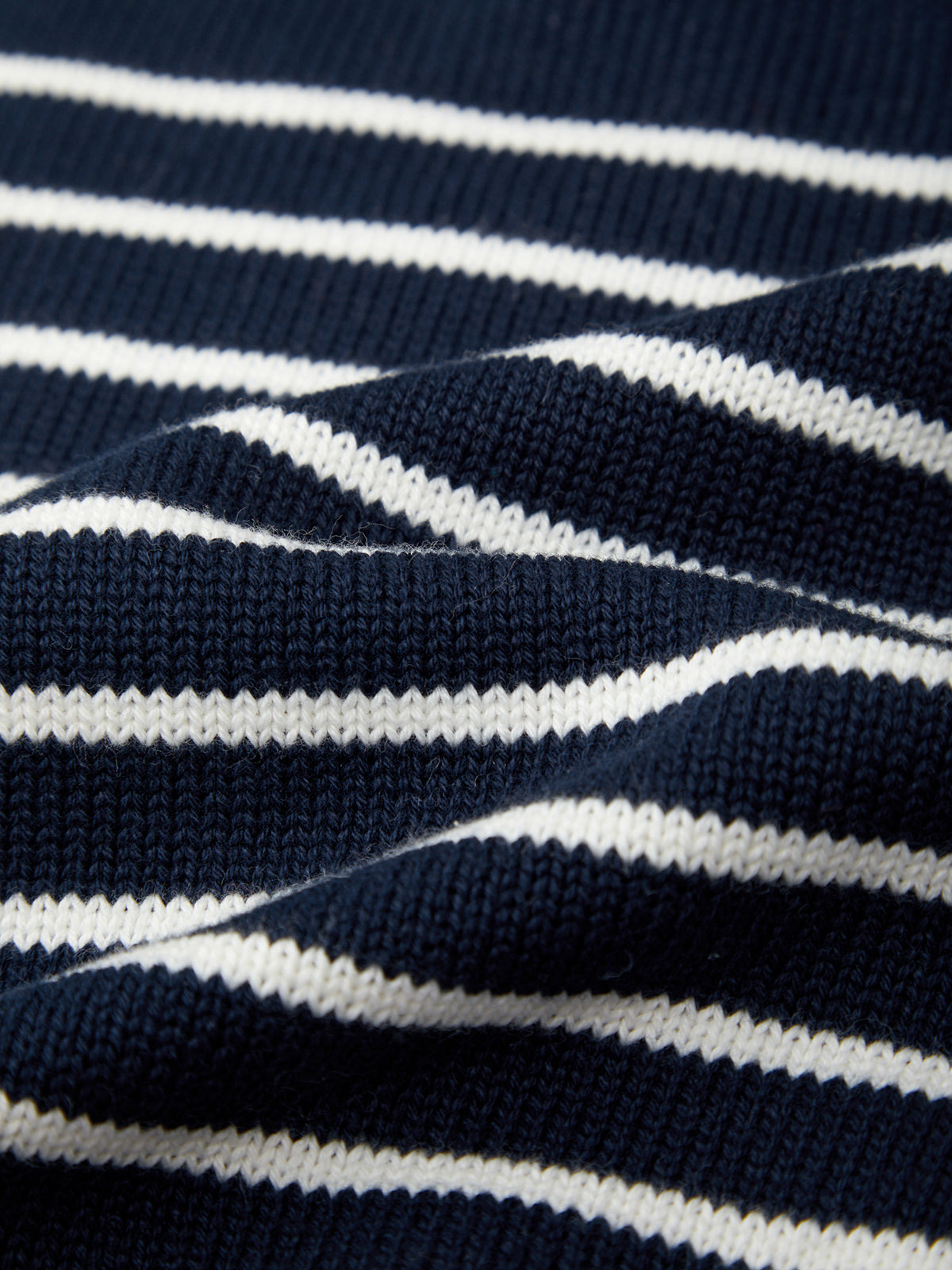 Close-up of navy and white striped fabric texture