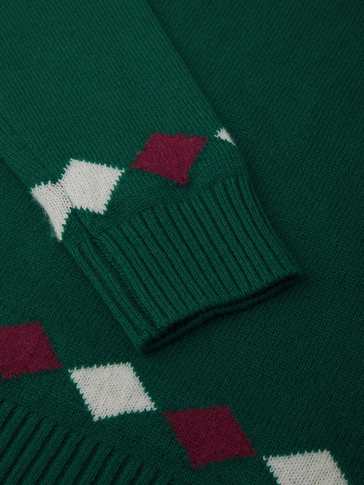 Green sweater with red and white diamond pattern