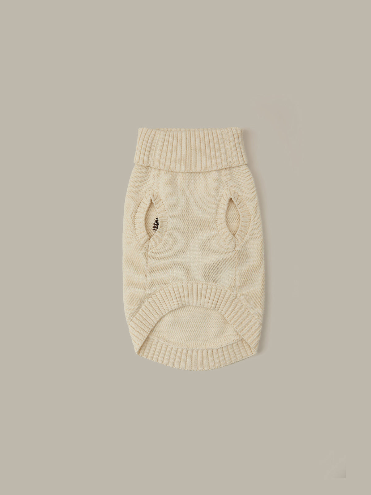 Beige knitted dog sweater on a light gray background