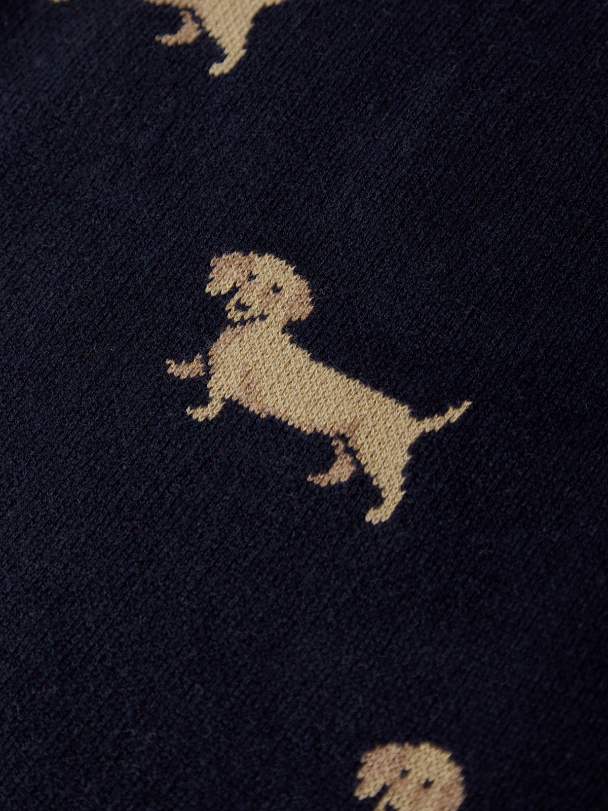 Navy blue fabric with beige dachshund dog pattern