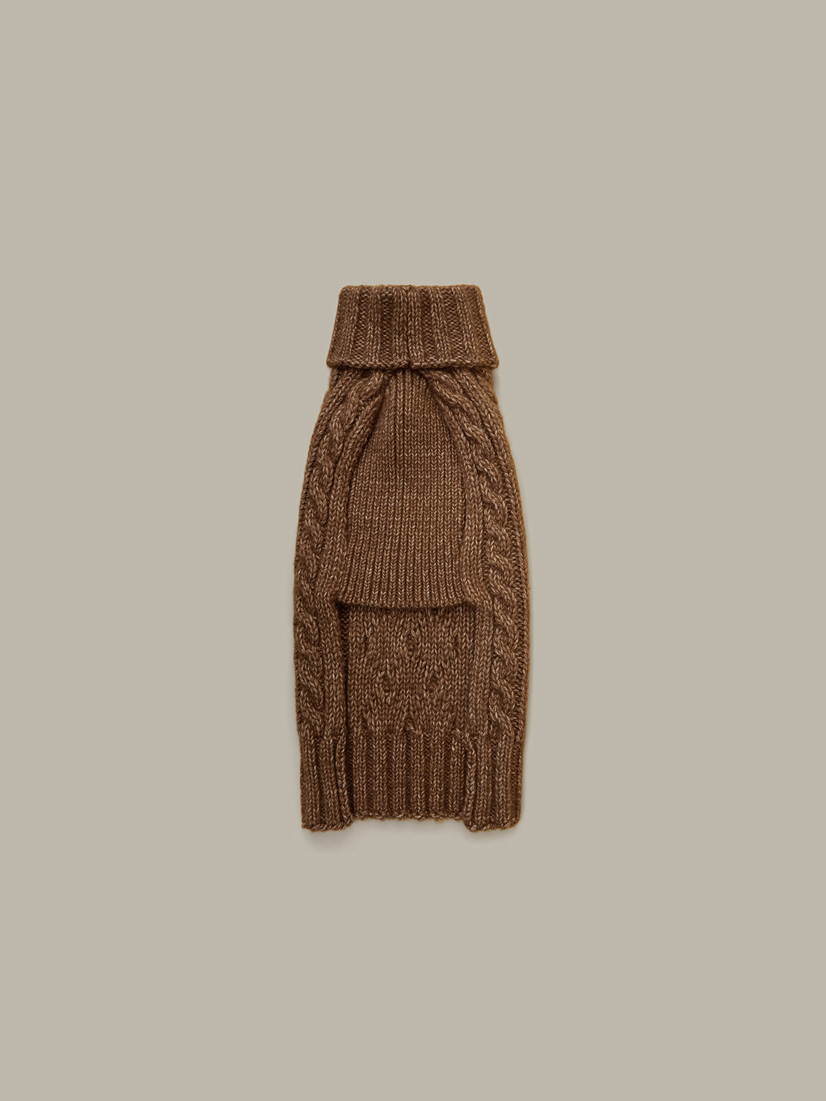 Brown knitted dog sweater on a beige background