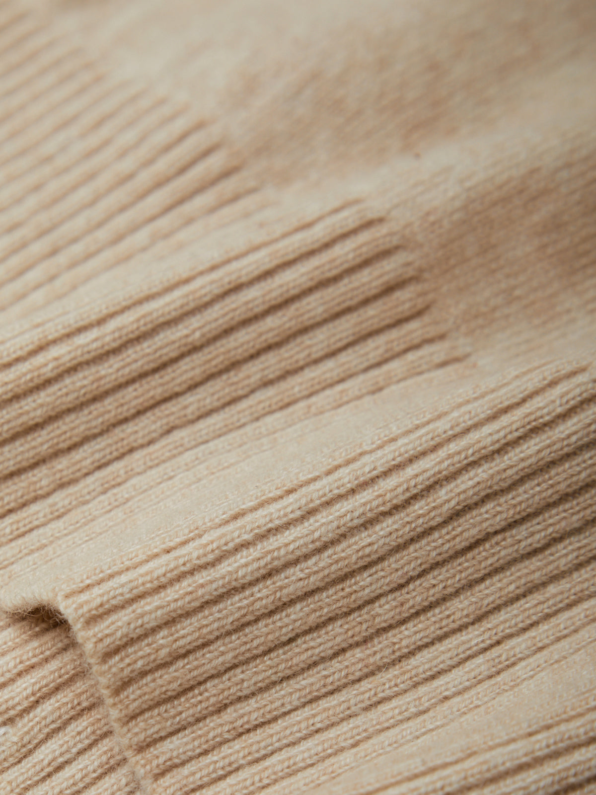 Close-up of beige ribbed fabric texture