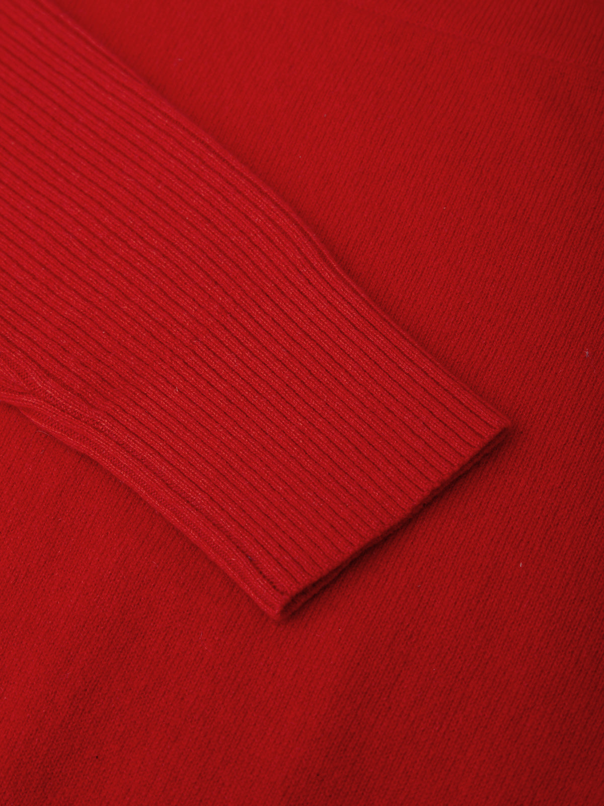 Close-up of a red ribbed sweater fabric