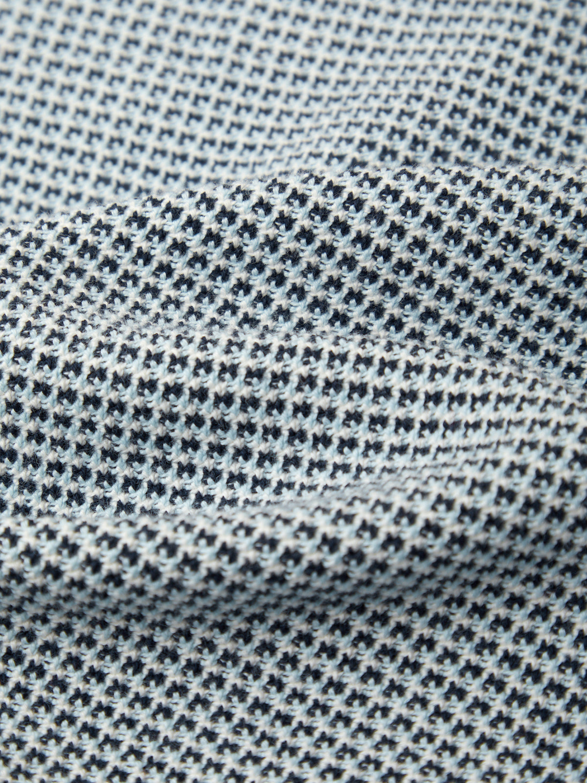 Close-up of a textured fabric with a small pattern