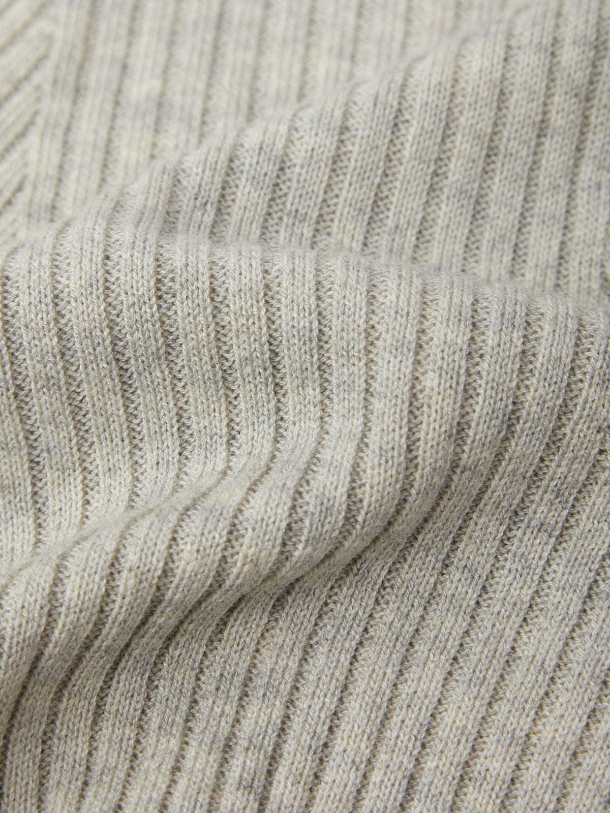Close-up of a textured gray fabric with a ribbed pattern