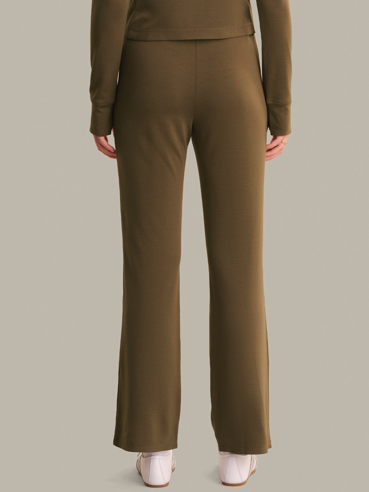 brown suit with pants on a neutral background