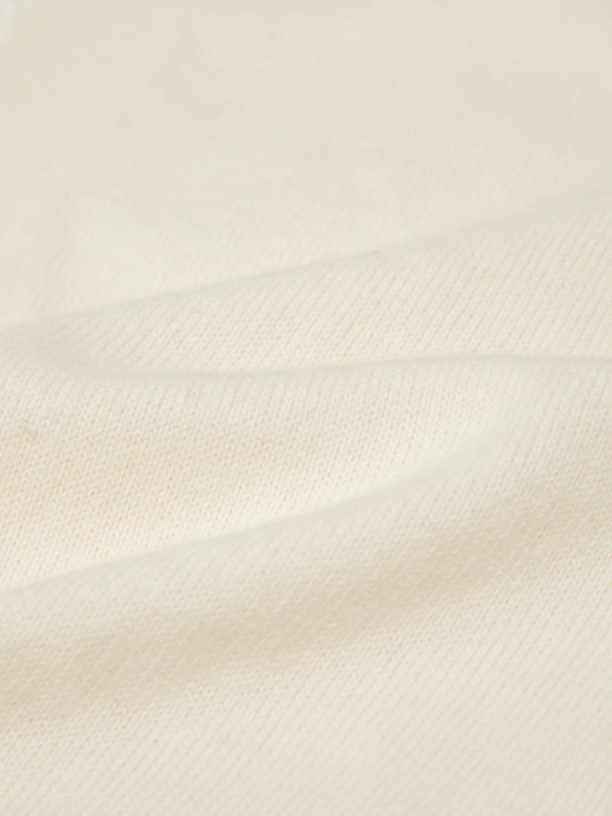 Close-up of a textured beige fabric surface