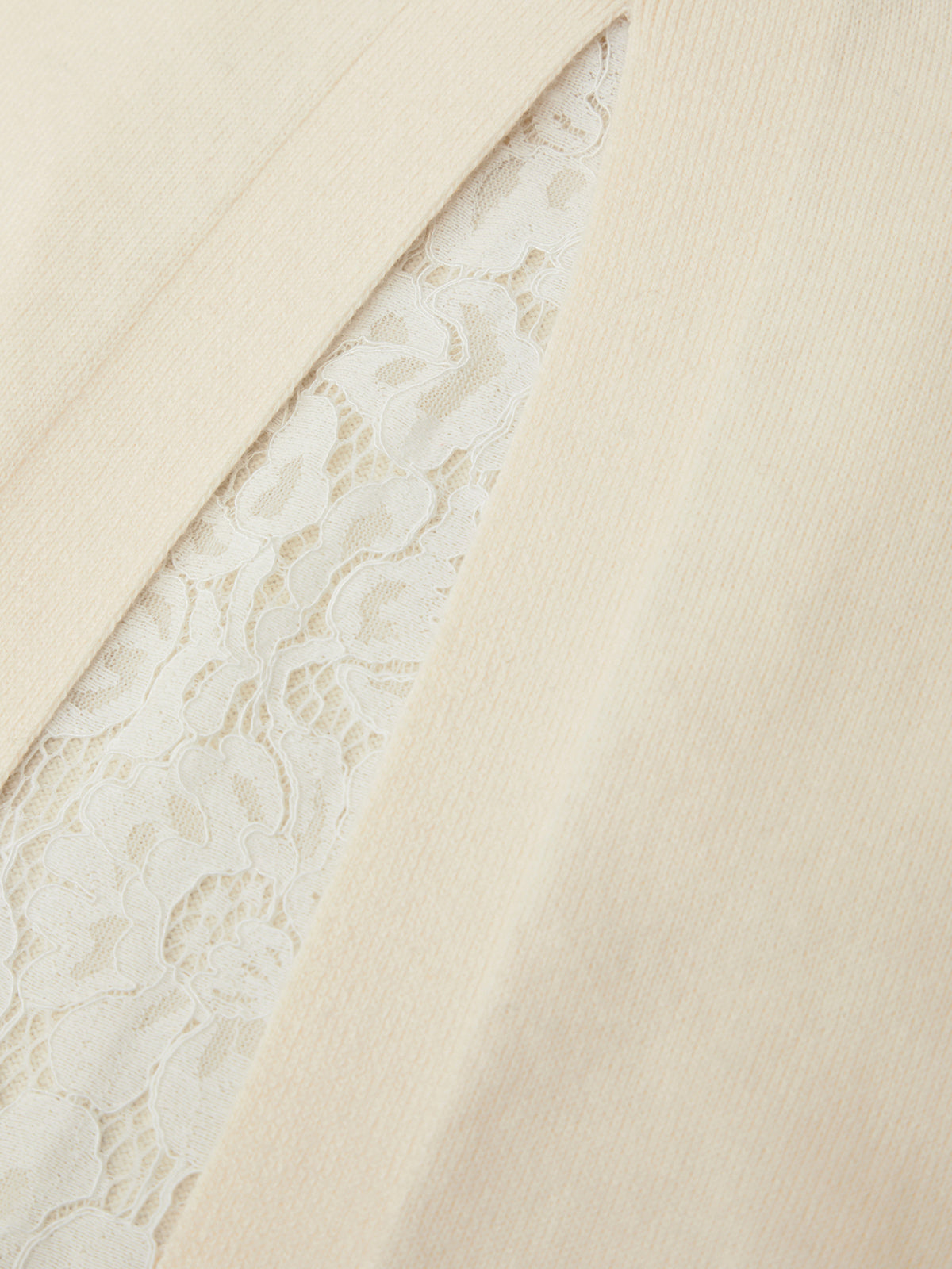 Close-up of beige fabric with lace trim
