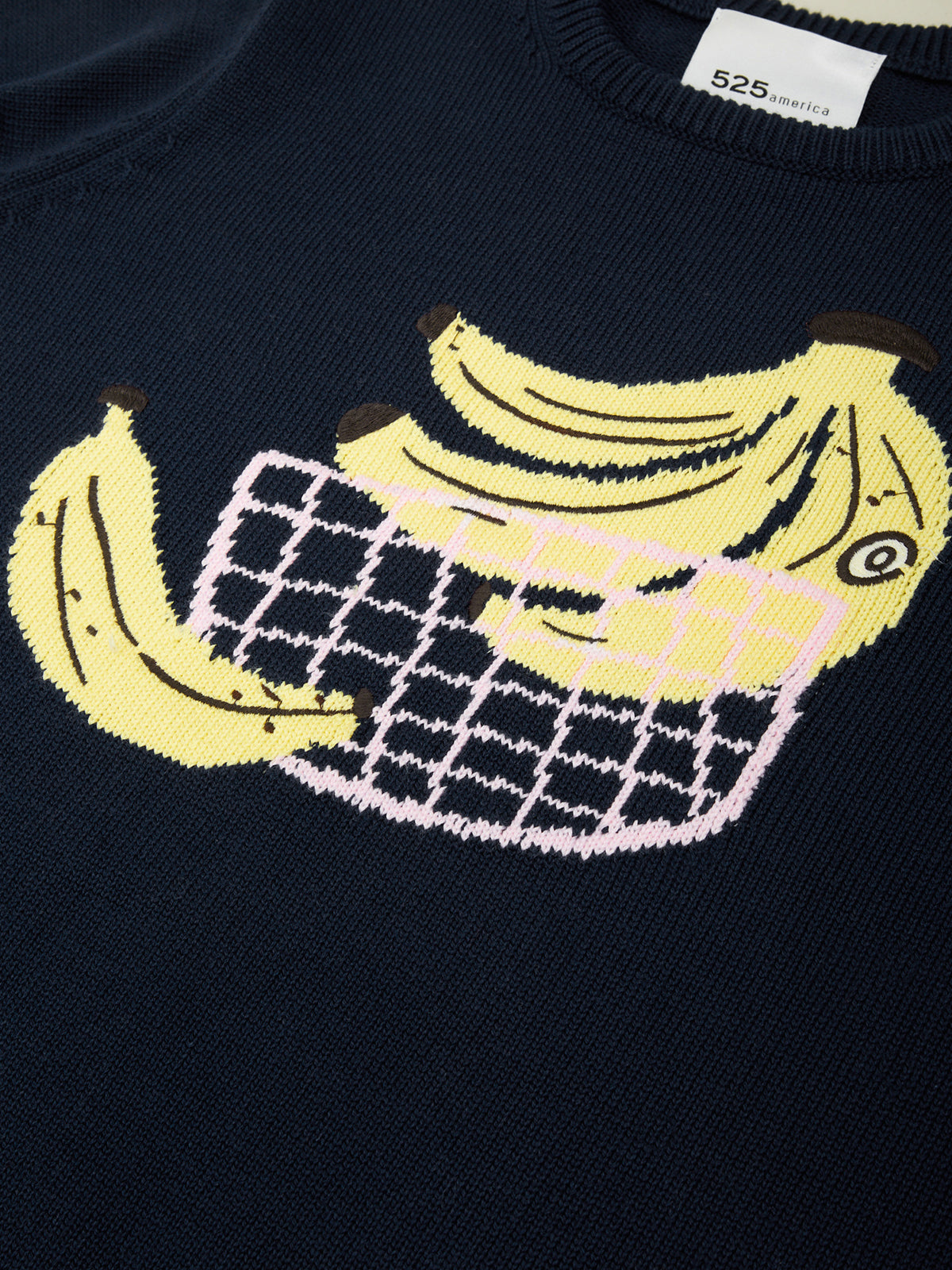 Navy sweater with yellow banana design on a plain background