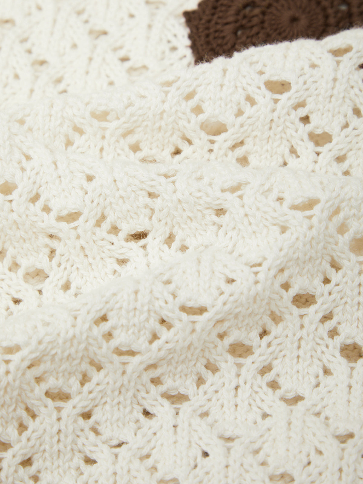 Close-up of a textured white fabric with a subtle pattern