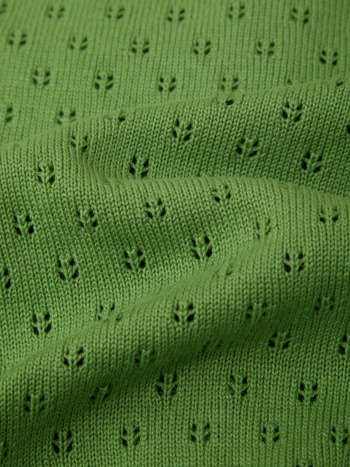 Close-up of green fabric with a subtle pattern
