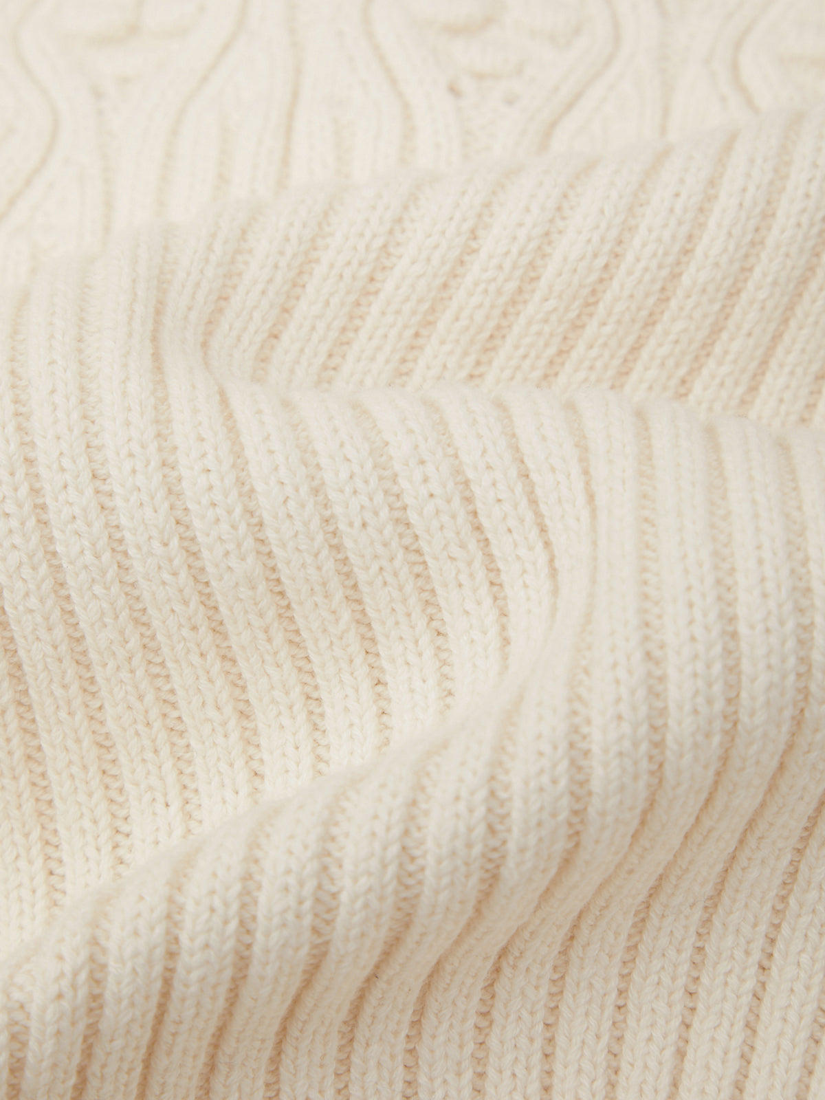 Close-up of beige fabric with wavy pattern