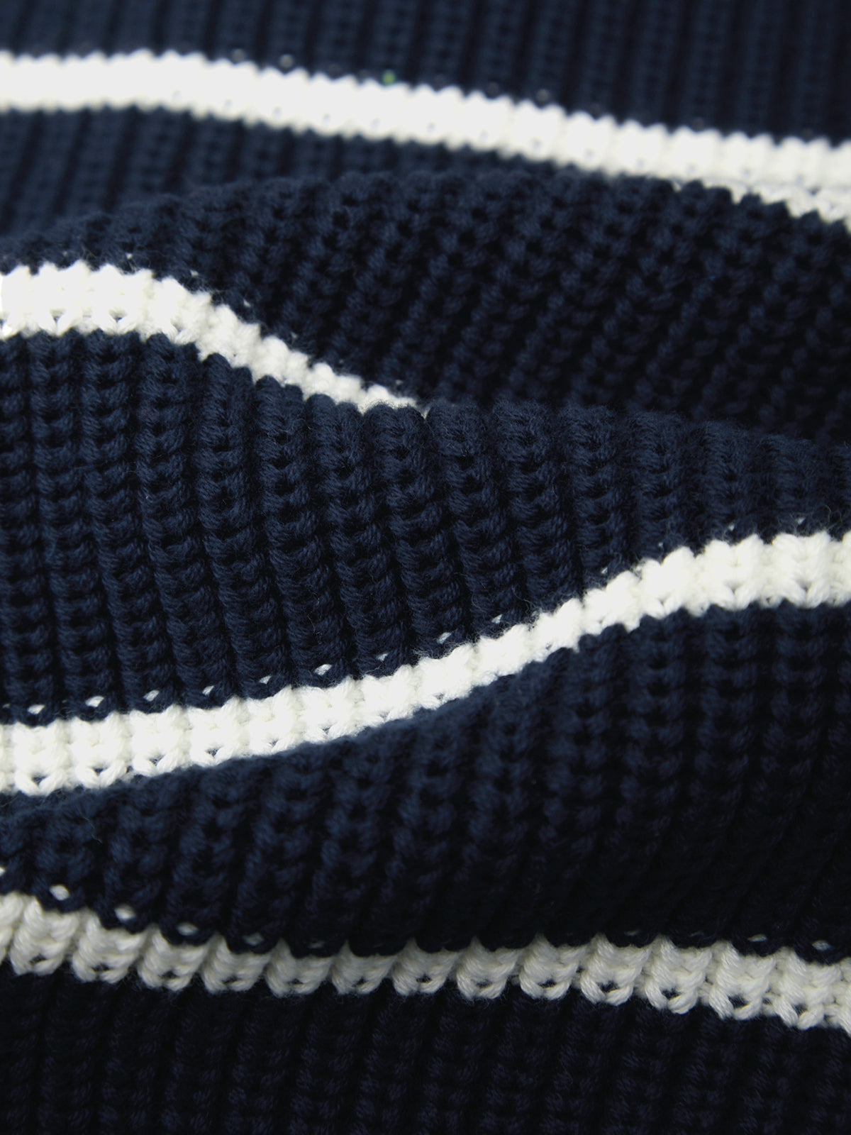 Close-up of a navy and white striped fabric texture