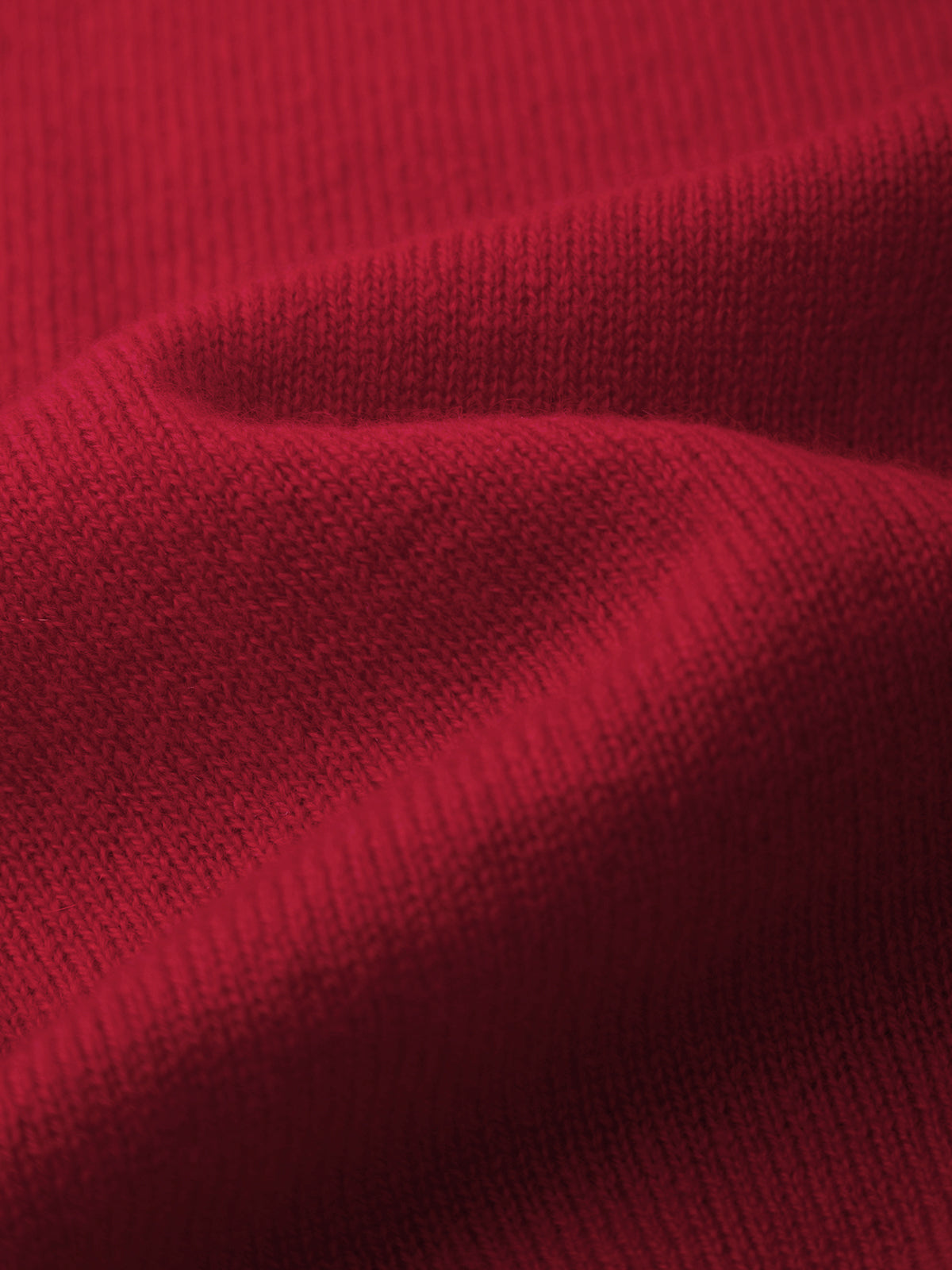 Close-up of red fabric with a textured pattern