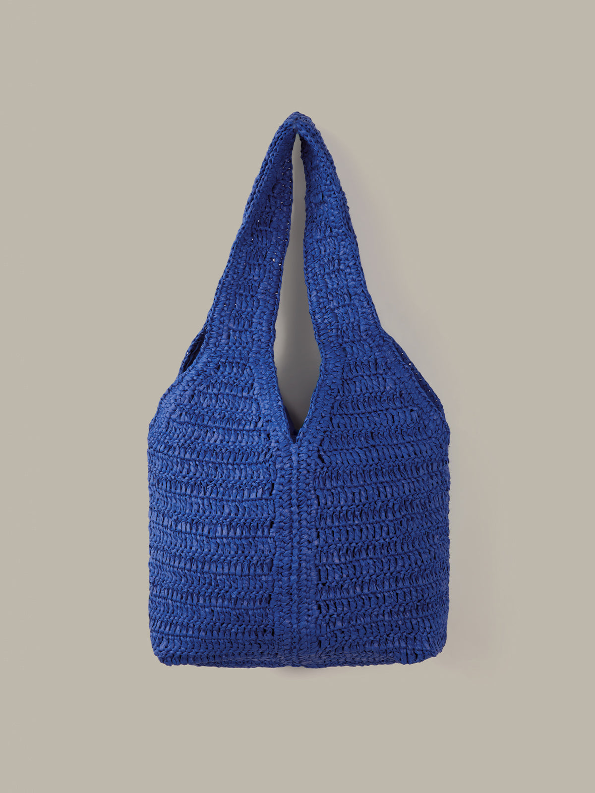 Blue crochet bag on a beige background