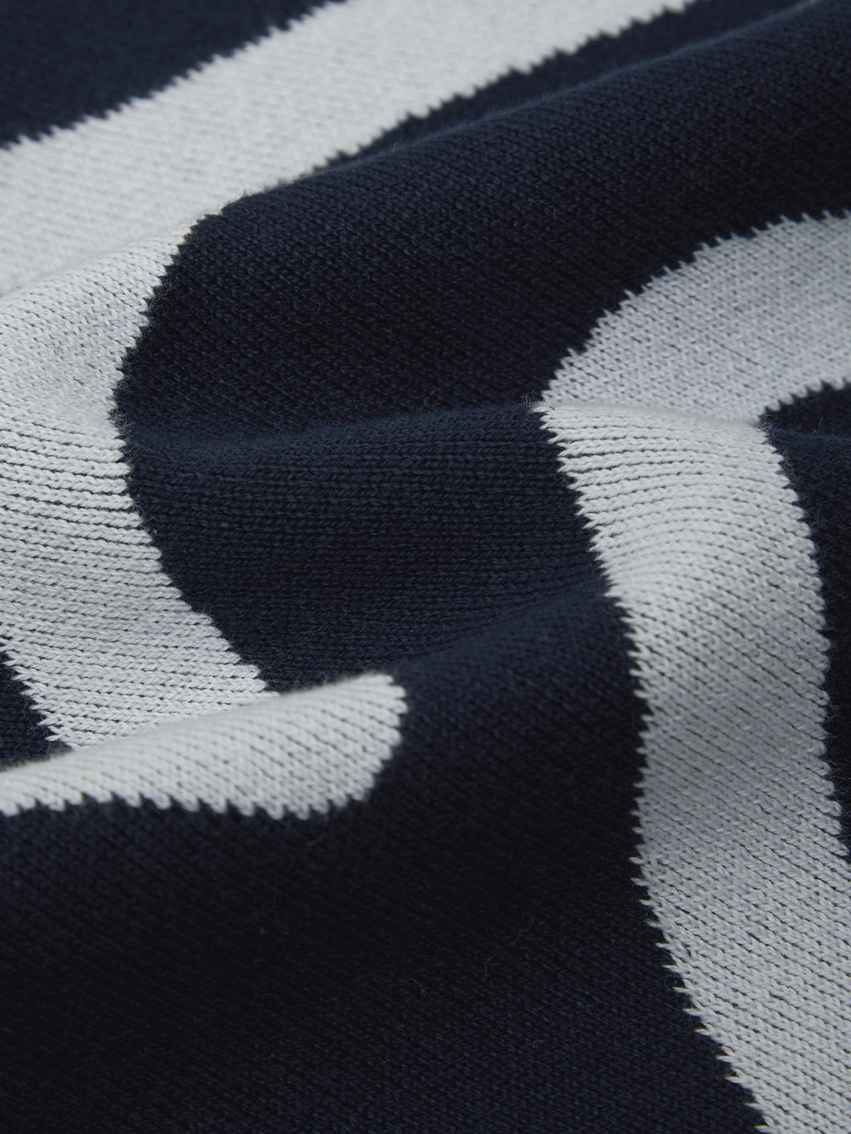 Close-up of a navy and gray striped fabric texture