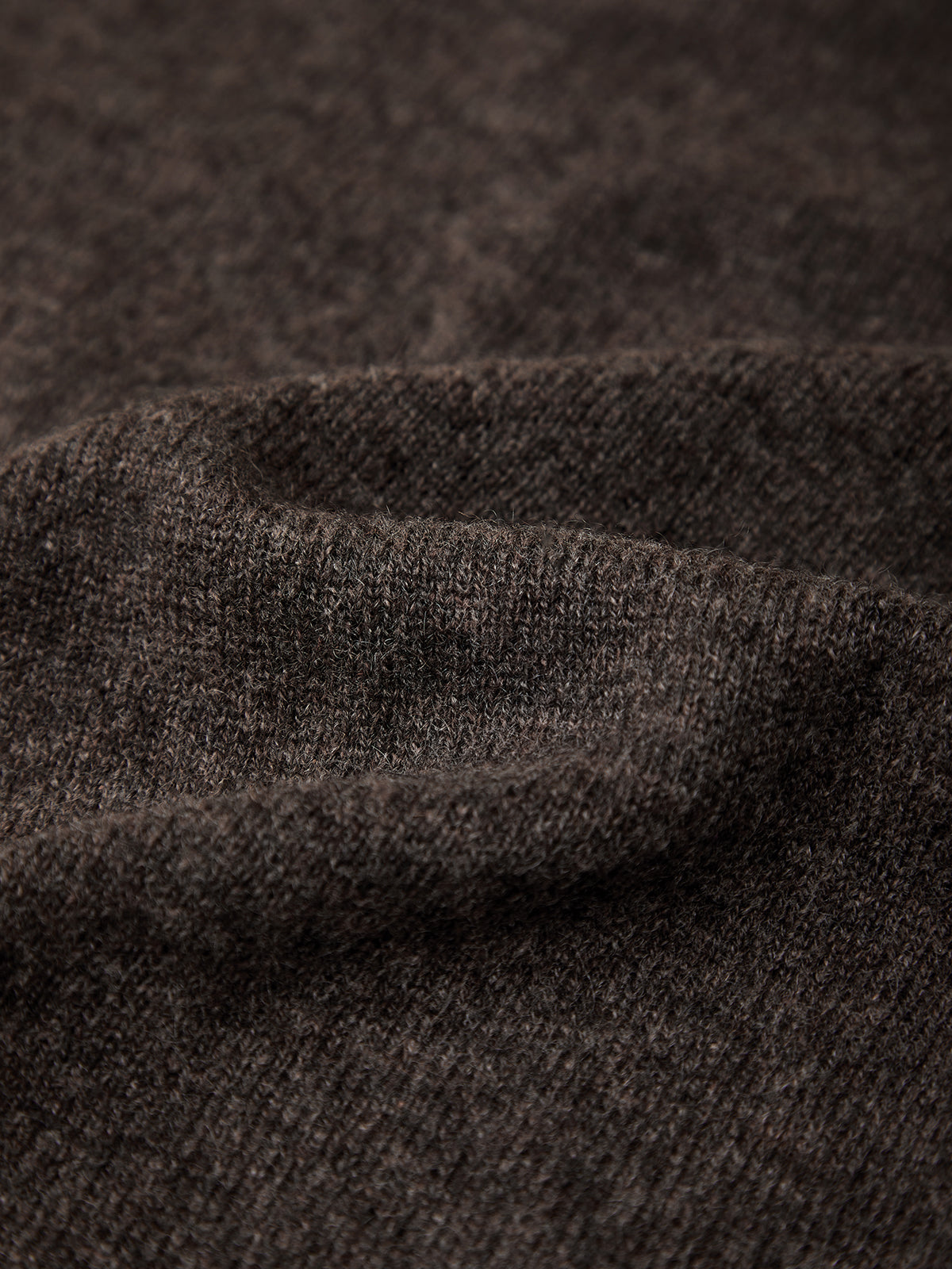 Close-up of brown fabric with a subtle pattern