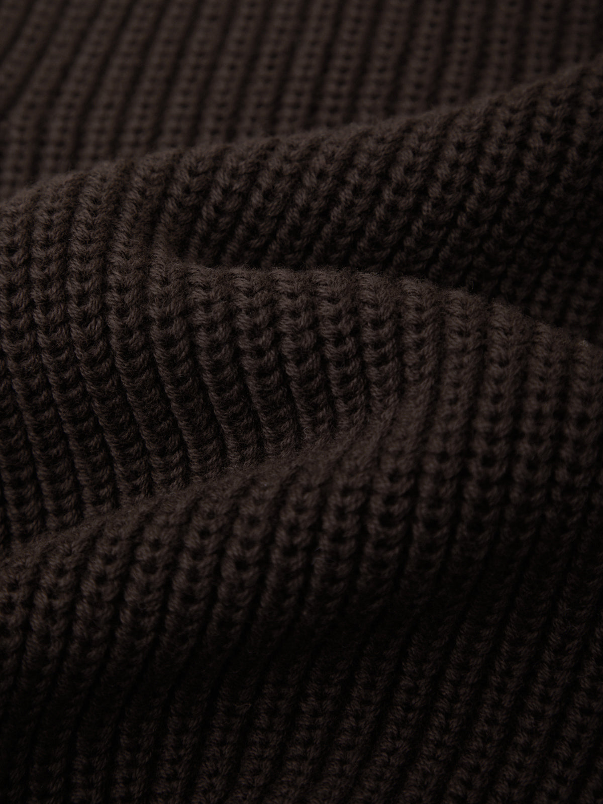 Close-up of dark brown textured fabric