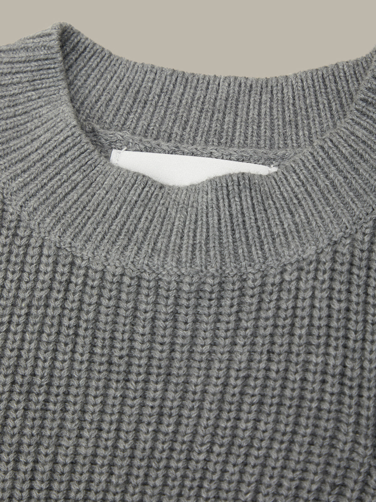 Close-up of a gray knitted sweater collar