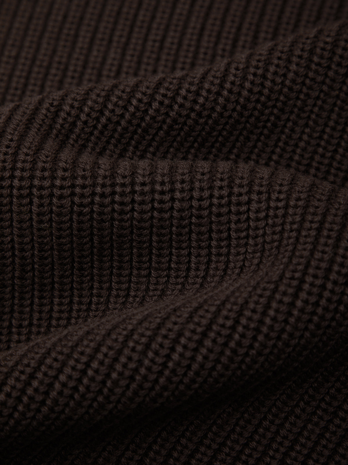 Close-up of dark brown textured fabric