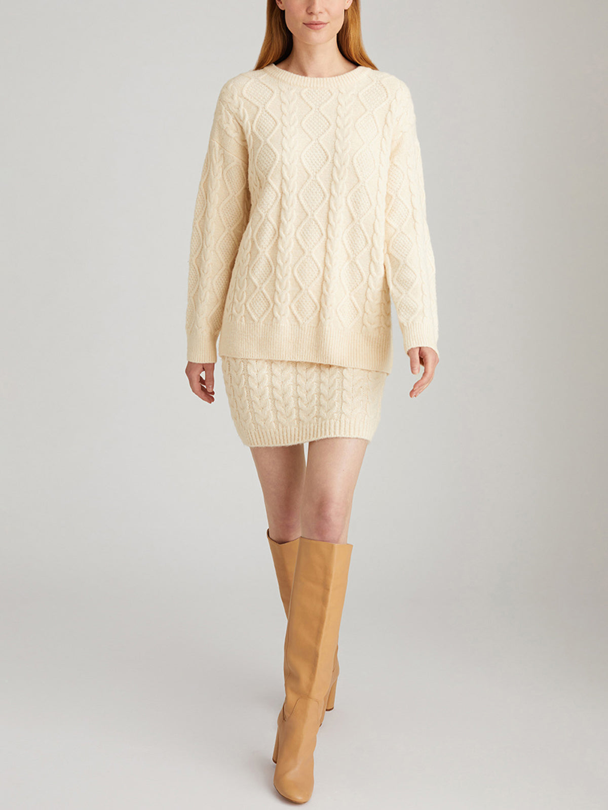 Cream cable knit dress with tan knee high boots