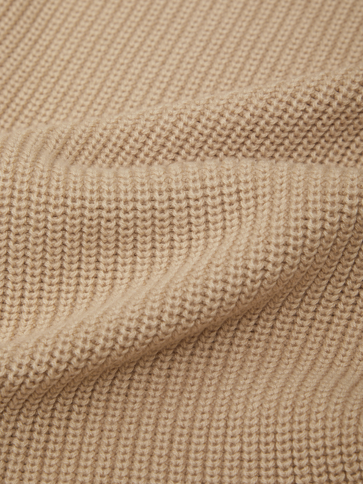 Close-up of beige textured fabric