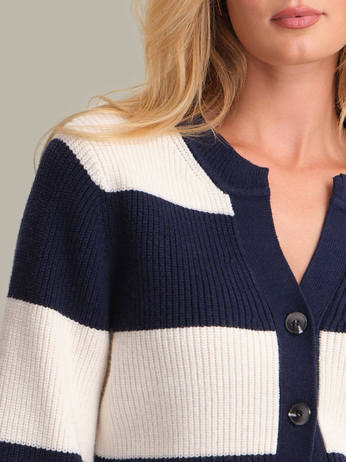 Navy and white striped cardigan worn by a person