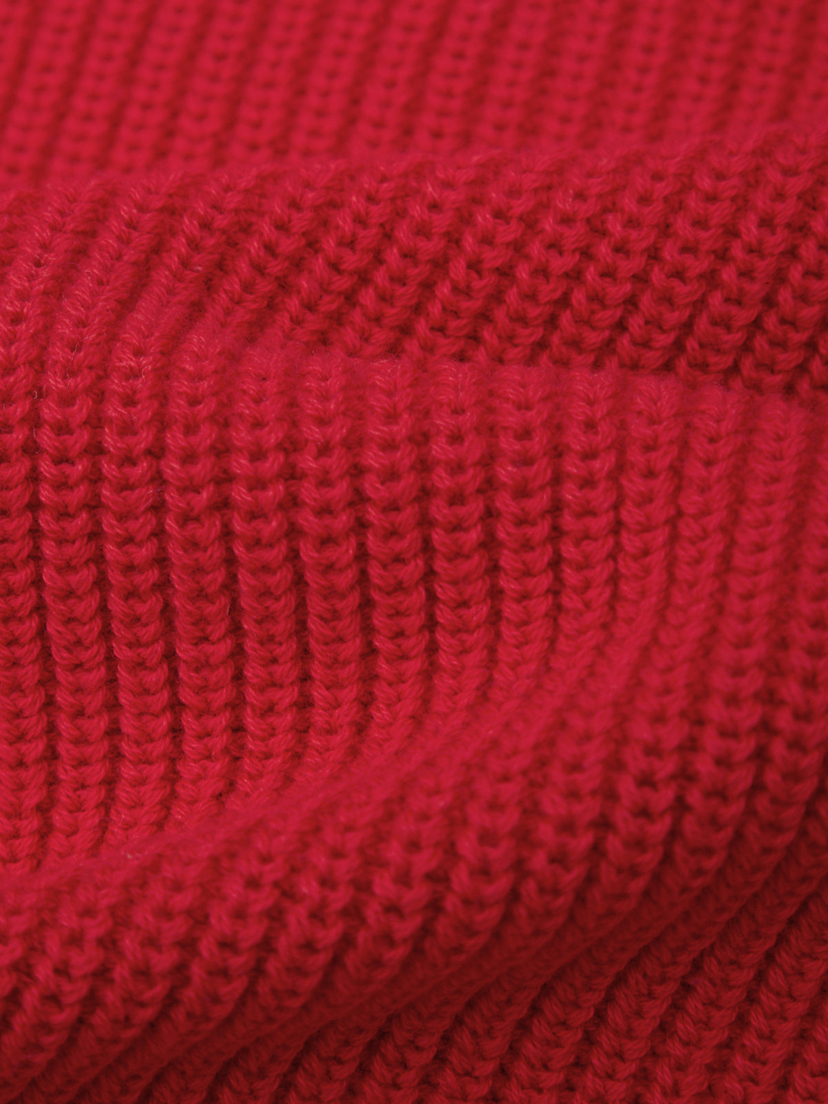 Close-up of red knitted fabric texture
